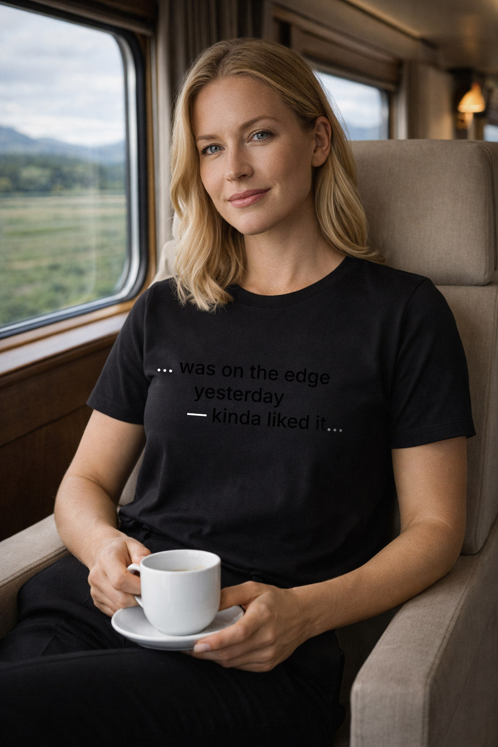 Relaxed woman wearing was on the edge yesterday kinda liked it on a train embracing the unknown.