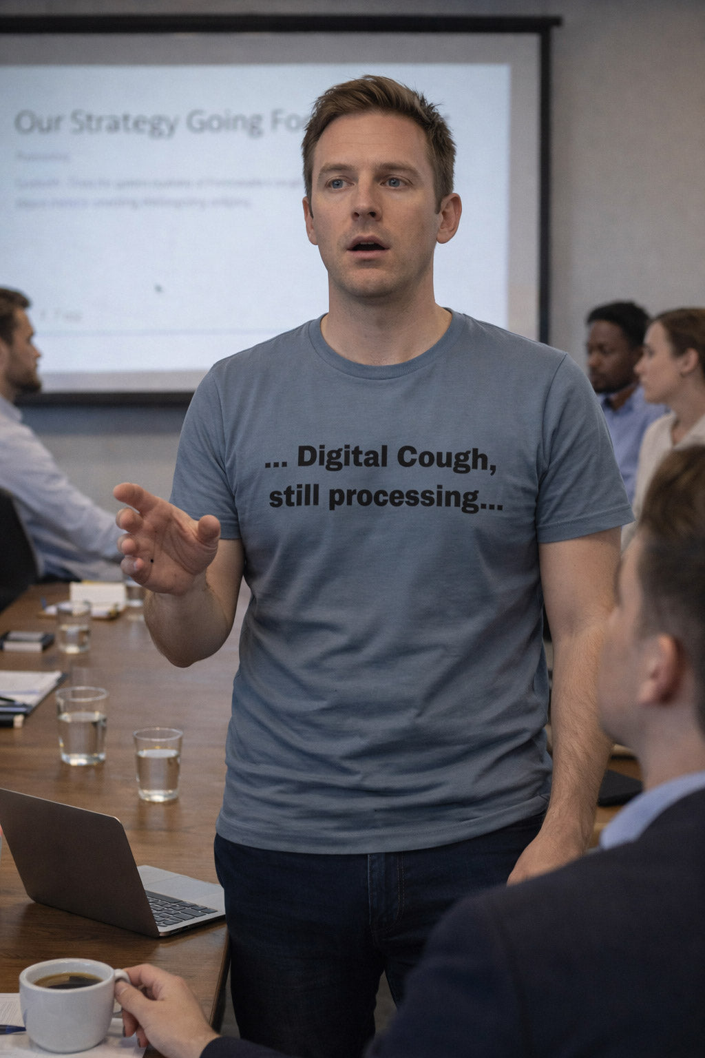Stunned man presenting in a meeting wearing digital cough still processing tee a funny gift.