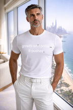 Confident man wearing growth isn't polite... It pushes with a city view, choosing to lean into the discomfort of progress.