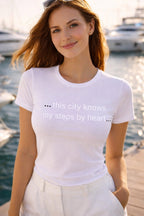 Cheerful person wearing ... this city knows my steps by heart... smiling from a yacht, celebrating profound belonging with this thoughtful gift.