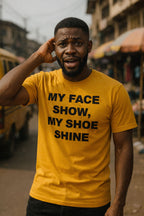Smiling guy touch head wear my face show, my shoe shine shirt because everything dey intact today.