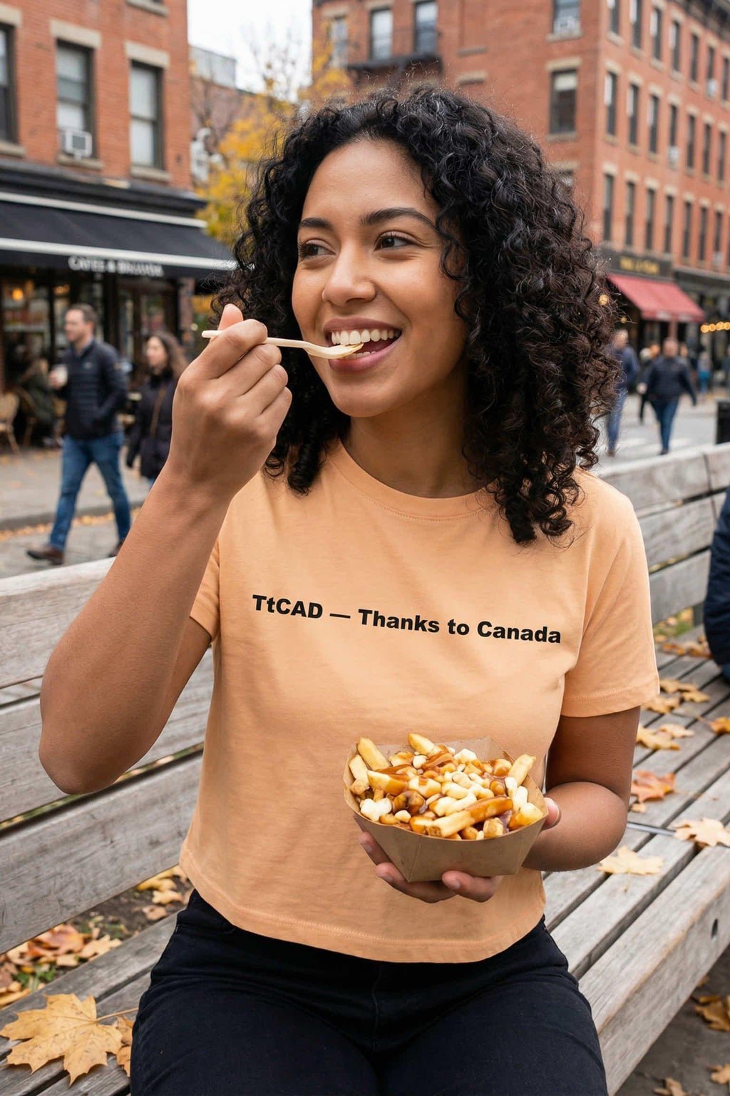 Happy woman enjoying outdoor food wearing thanks to Canada celebrating northern hospitality, perfect gift for travelers.