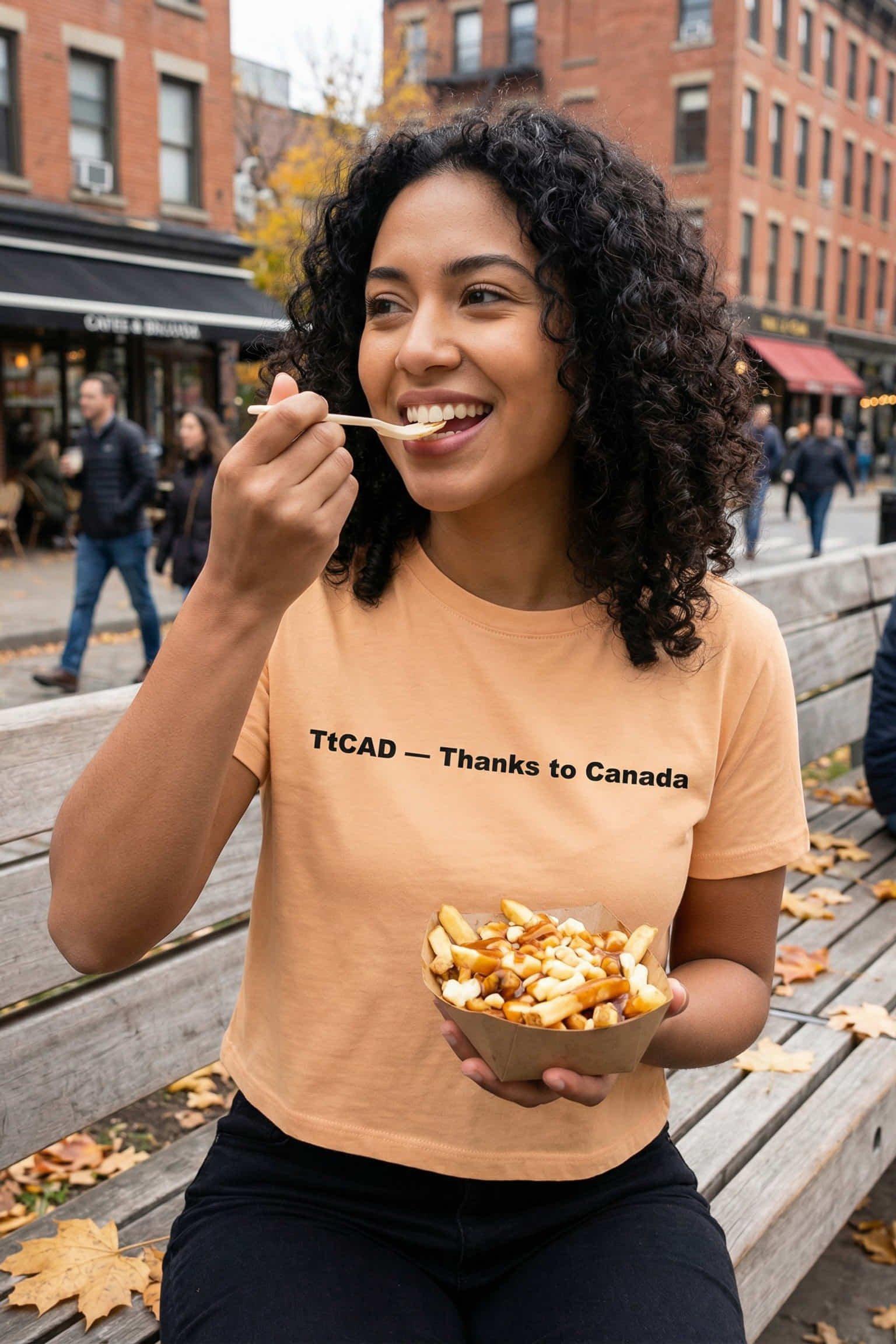 Happy woman enjoying outdoor food wearing thanks to Canada celebrating northern hospitality, perfect gift for travelers.