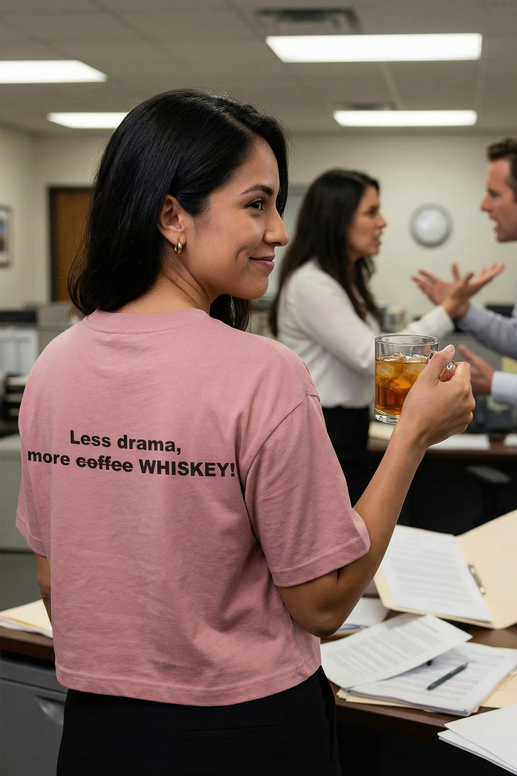 Smiling woman in an office wearing less drama more coffee whiskey handling messy complications, ideal coworker gift.