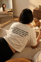 Relaxed woman eating takeout wearing almost impossible to stay skinny and sober embracing indulgences, a perfect gift.