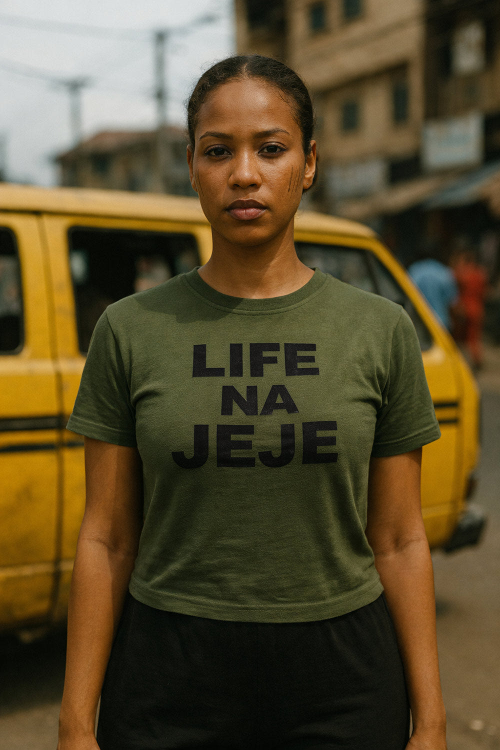 Serious lady stand outside wear life na jeje tee because you must take everything step by step.