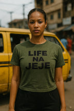 Serious lady stand outside wear life na jeje tee because you must take everything step by step.