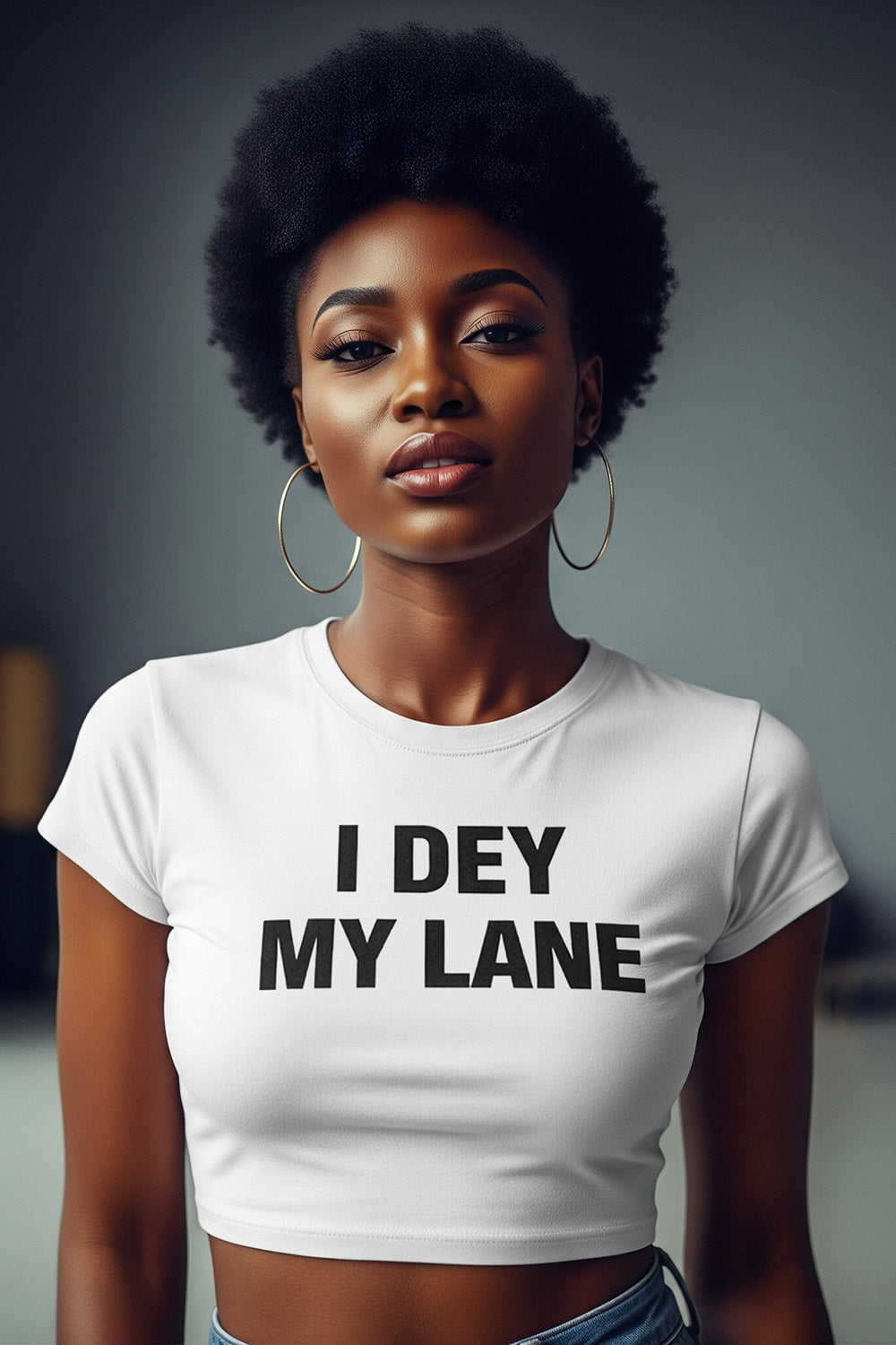 Fine girl with afro hair wear i dey my lane top to focus on personal growth.