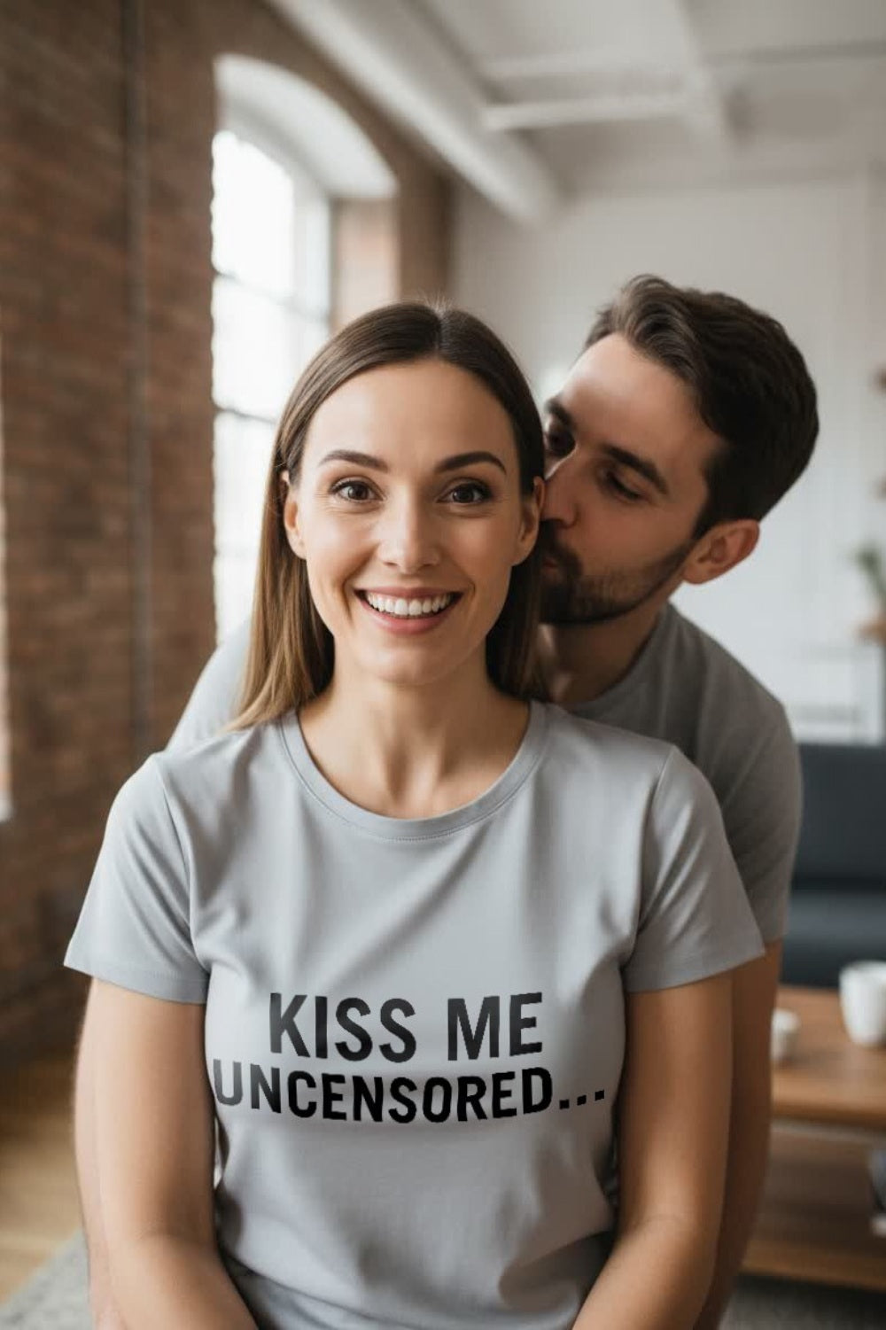 Happy couple relaxing indoors wearing kiss me uncensored sharing raw unapologetic vulnerability, an ideal romantic gift.