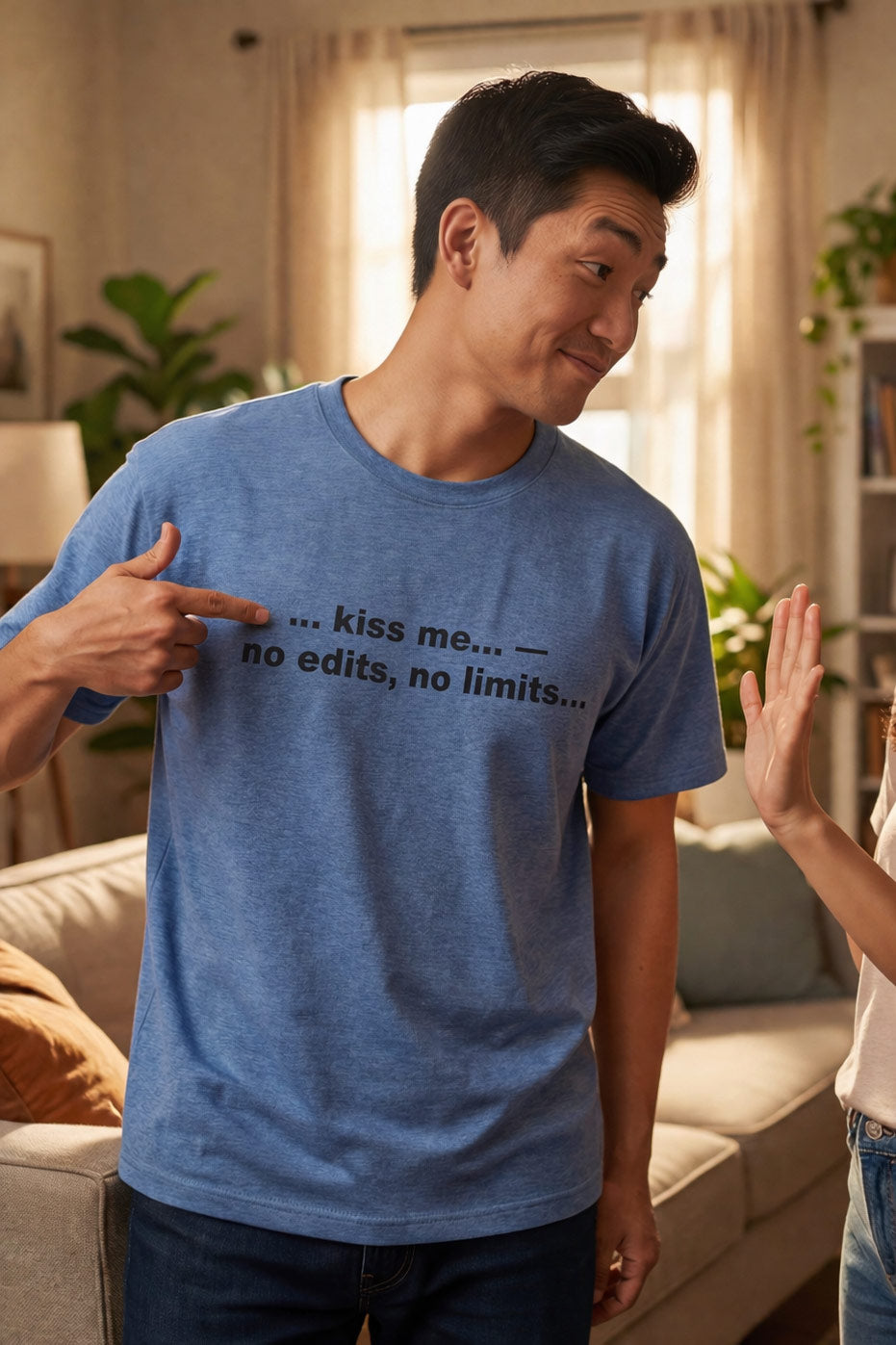 Playful man in living room wearing kiss me no edits no limits tee ideal for a partner.