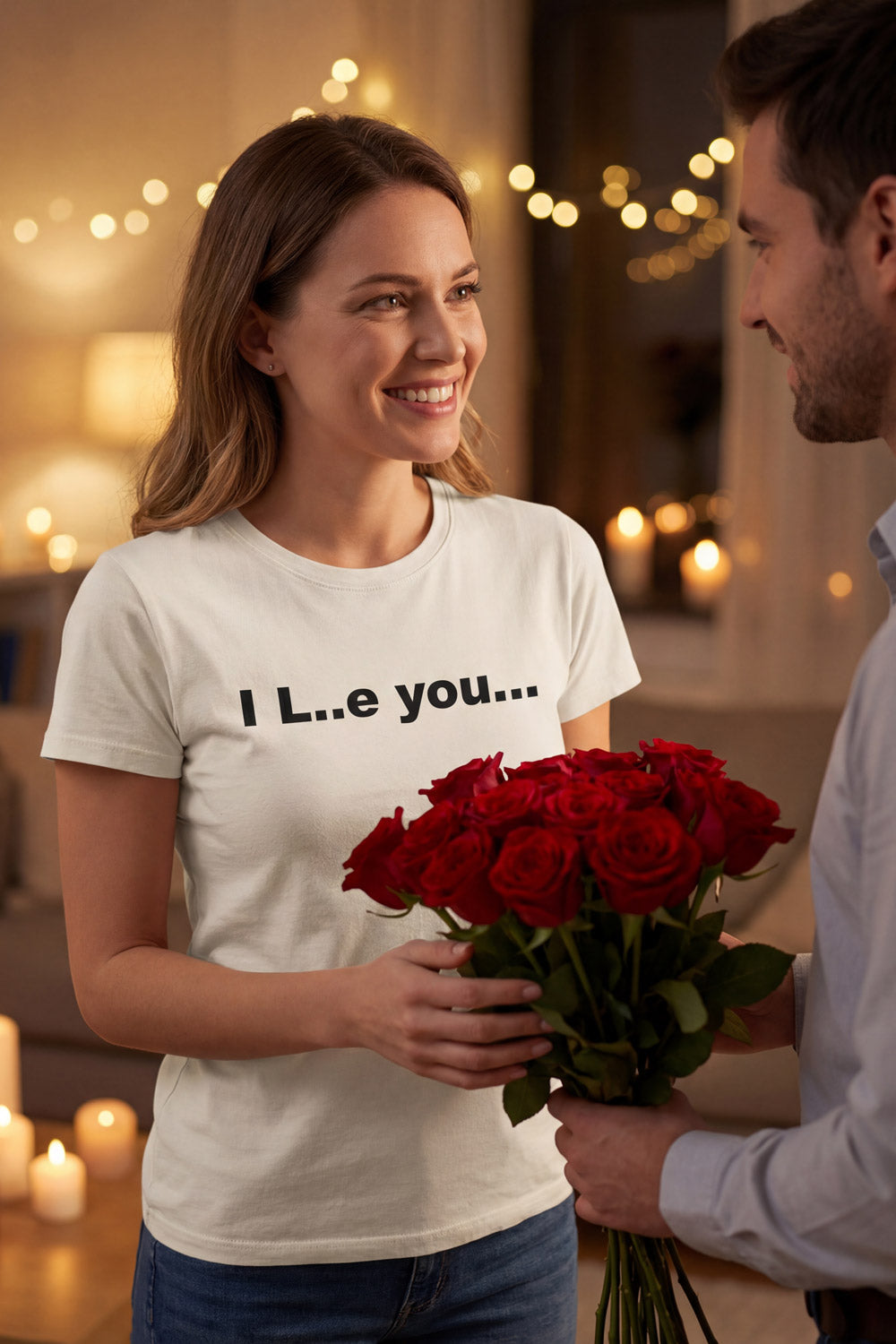 Smiling woman receiving red roses wearing the I L..e you shirt showing playful charm perfect for partners.