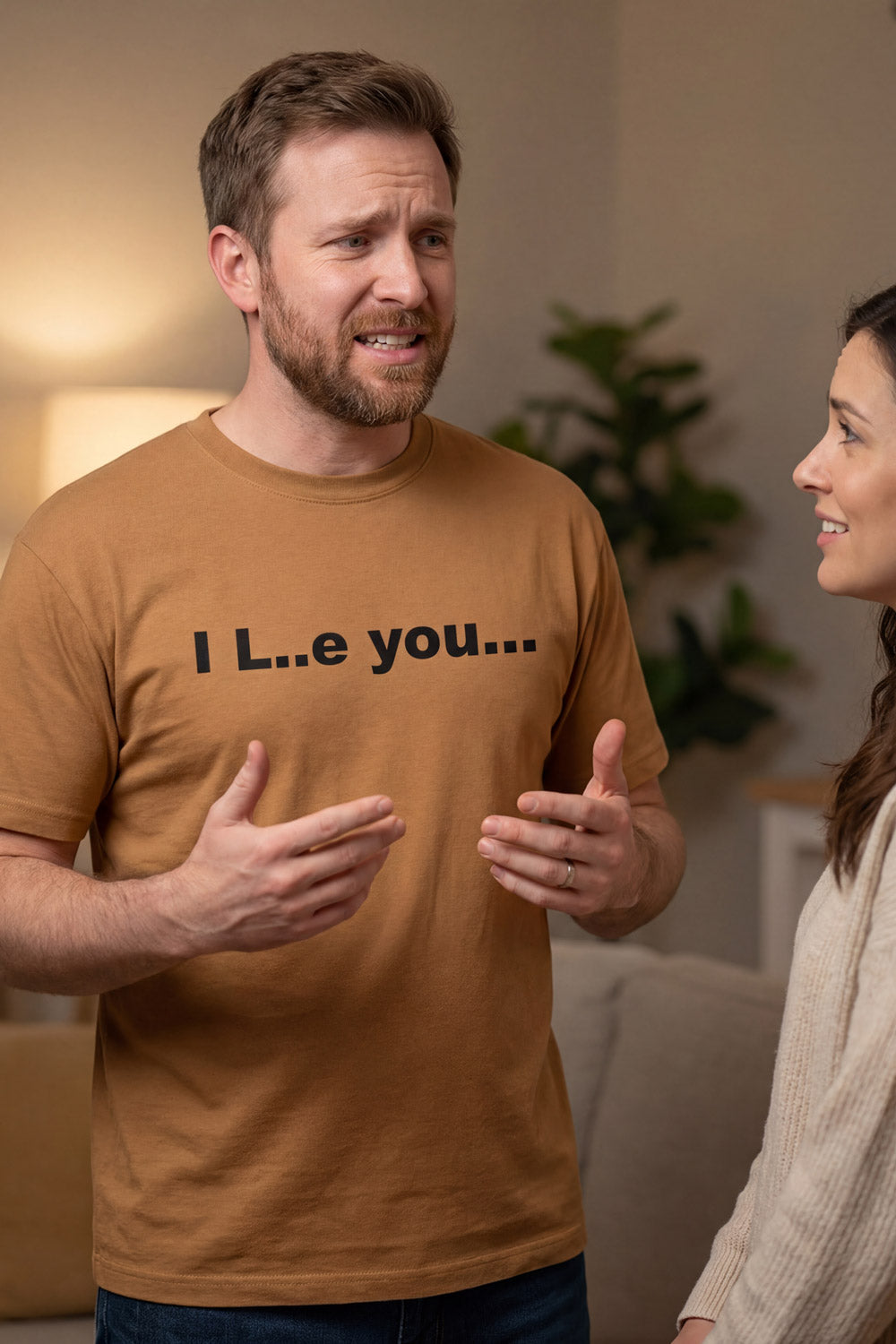 Expressive man talking in a living room wearing the I L..e you shirt keeping connections wonderfully unpredictable.