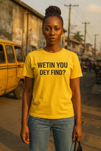 Serious lifestyle shot of person wearing wetin you dey find tee because true peace no need drama.