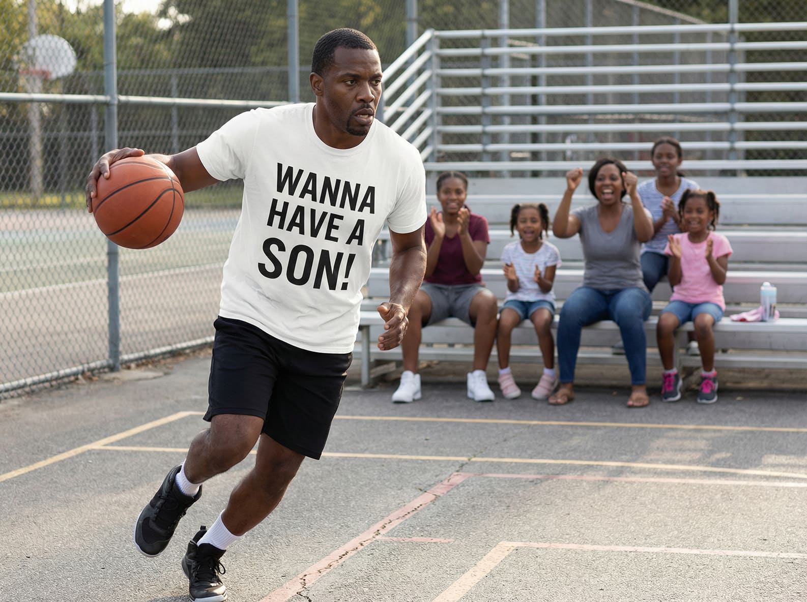 Sporty and confident: man in WANNA HAVE A SON! white tee playing basketball; unique gift for a future dad or a brother who loves bold statements