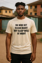 Calm young man stand wear na who get clean heart dey sleep well at night top as gift.