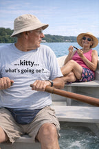 Older man rowing a small boat wearing kitty what's going on laughing at absurdity, ideal grandpa gift.