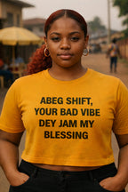 Serious girl stand wear abeg shift your bad vibe dey jam my blessing tee for peace.