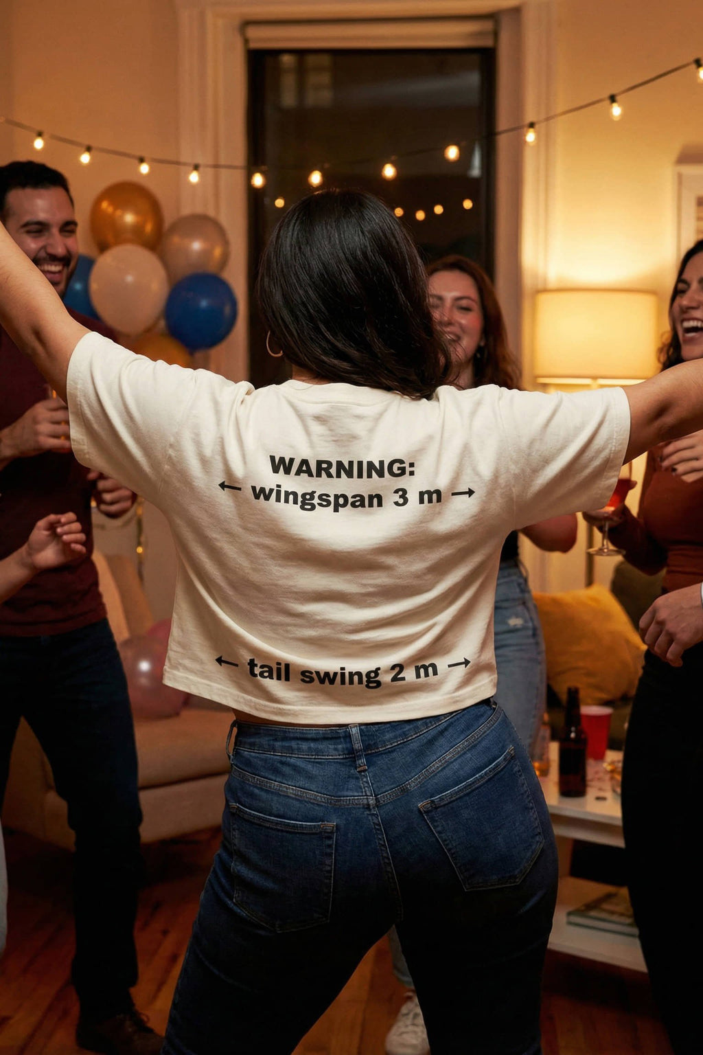 Dancing woman wearing warning wingspan 3 m tail swing 2 m proudly claiming space, perfect clumsy gift.