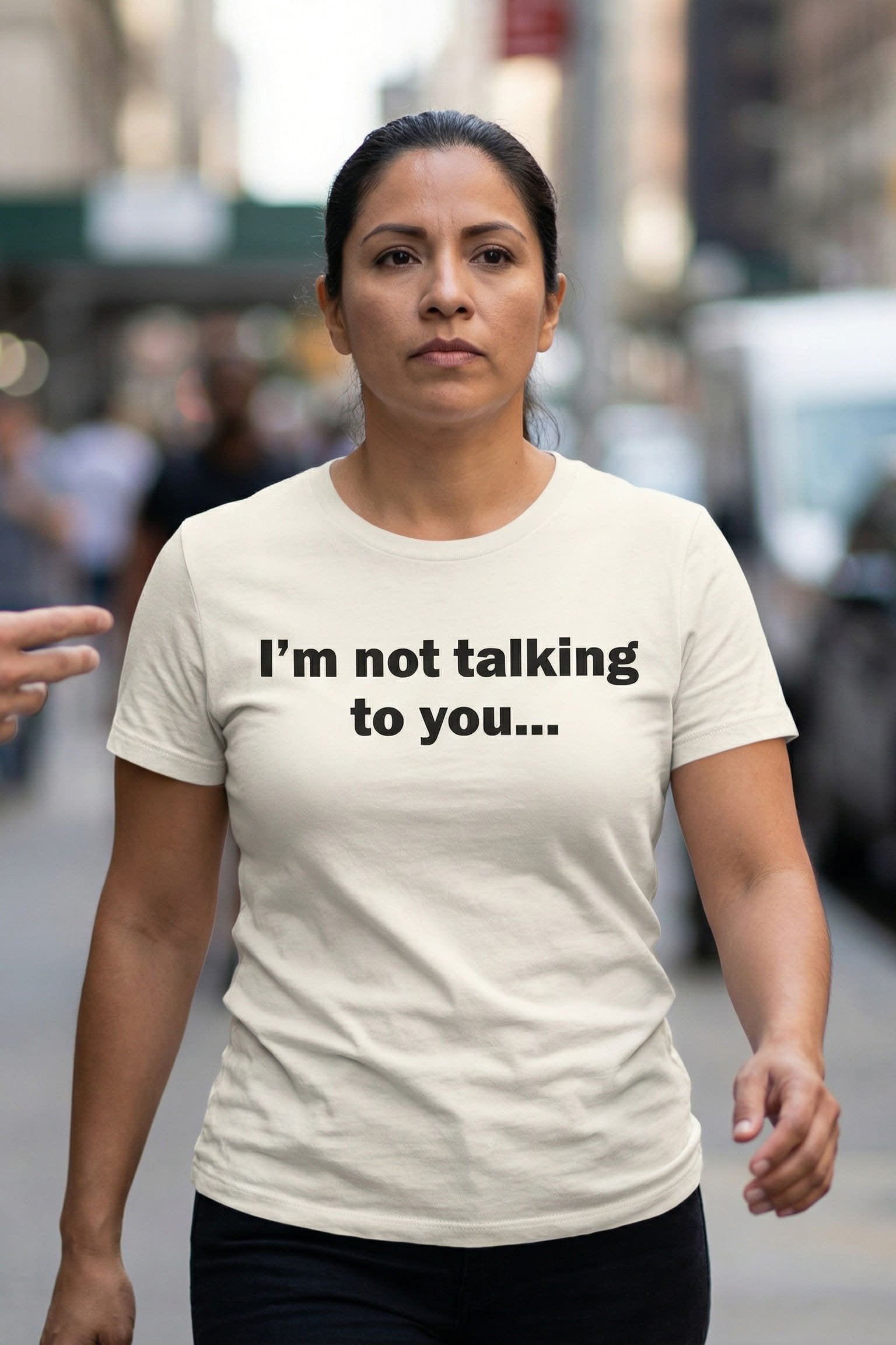Strong woman walking outside wearing I'm not talking to you showing playful defiance, ideal gift for friends.