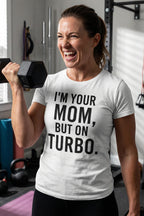 Energetic woman lifting weights wearing I'm your mom but on turbo embracing beautiful chaos, perfect mom gift.