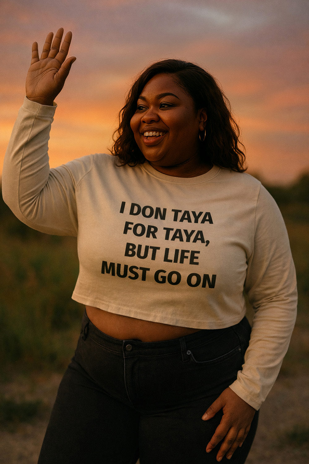 Smiling woman waving hand in I don taya for taya but life must go on strong spirit gift.