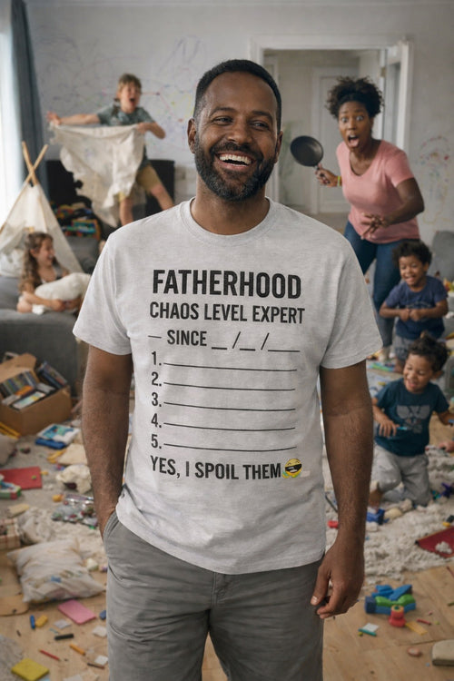 Real life fatherhood: man in FATHERHOOD. Chaos Level: Expert tee; great birthday or Father's Day gift for a dad who handles daily chaos with a smile