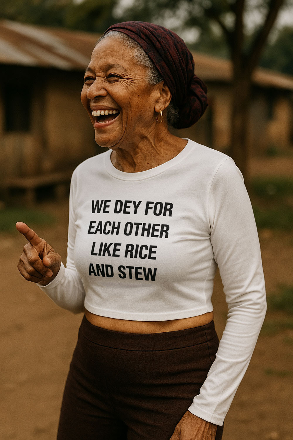 Happy older woman pointing wearing we dey for each other like rice and stew natural combination gift.