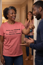Cheerful woman handing over keys in you're my premium son-in-law no upgrades needed shirt validating relationships.