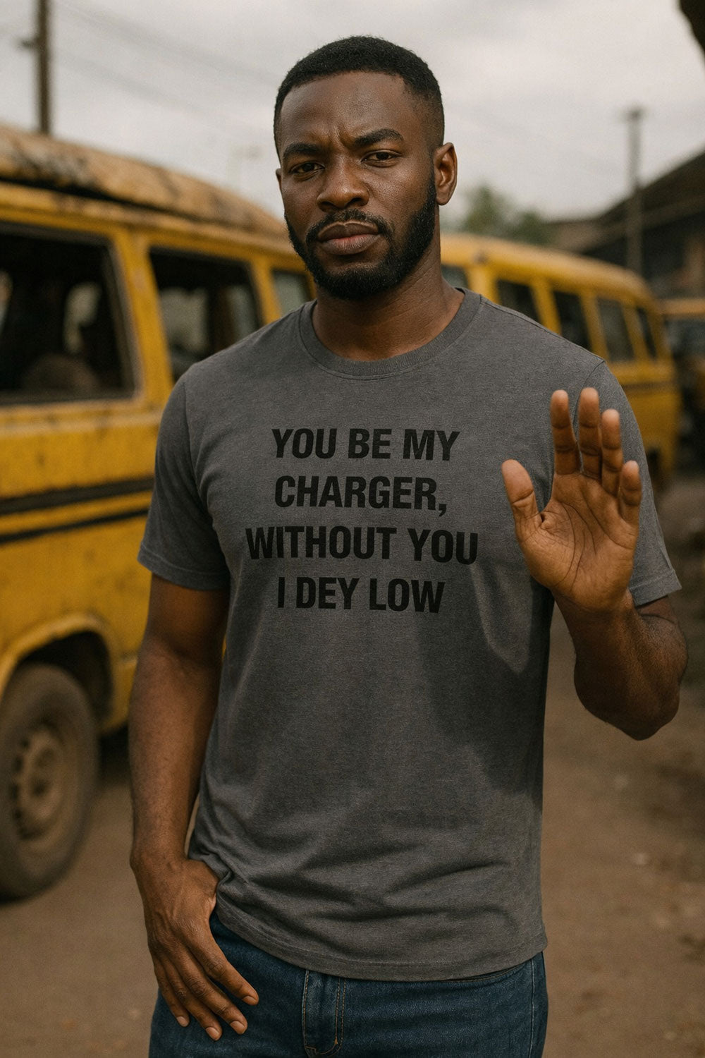 Confident man raising hand wearing you be my charger without you I dey low vital strength gift.