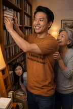 Cheerful man helping with books wearing I adore my mother-in-law tee ideal for supportive families.
