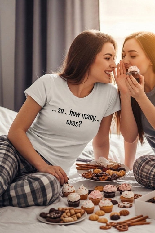 Two women sharing secrets on a bed wearing so how many exes breaking the ice, perfect gift.