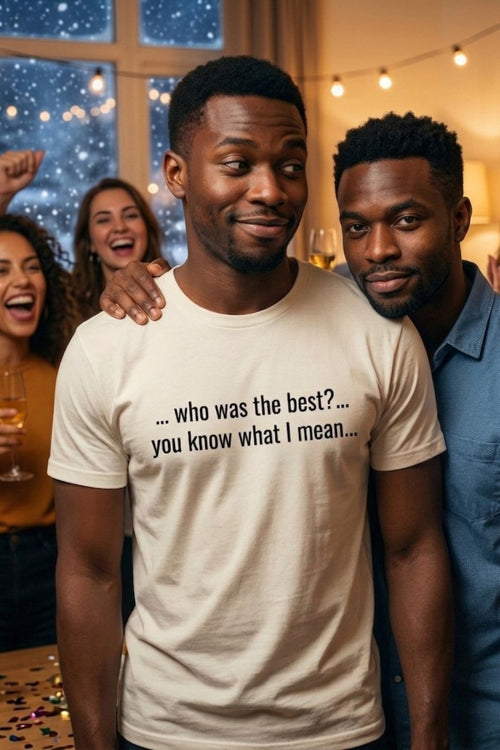 Smirking man at a gathering wearing who was the best you know what I mean, ideal friend gift.