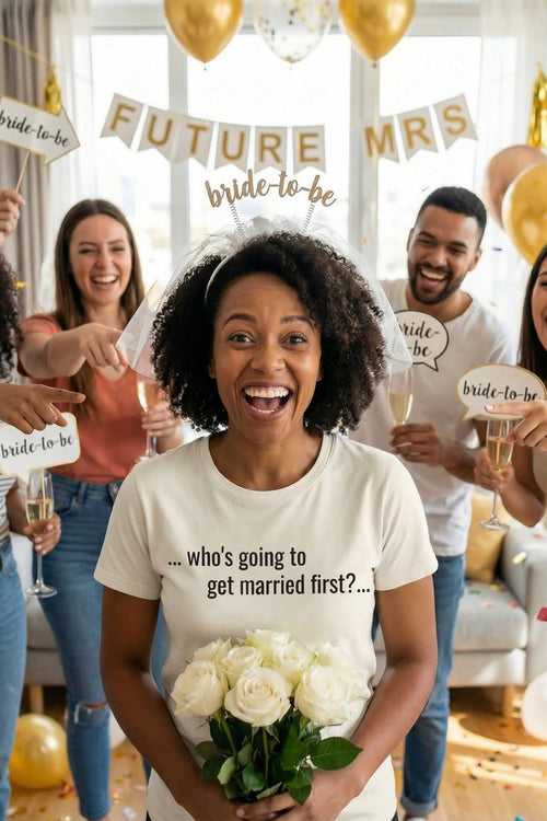 Happy woman holding white roses wearing who's going to get married first anticipating love, perfect bridesmaid gift.