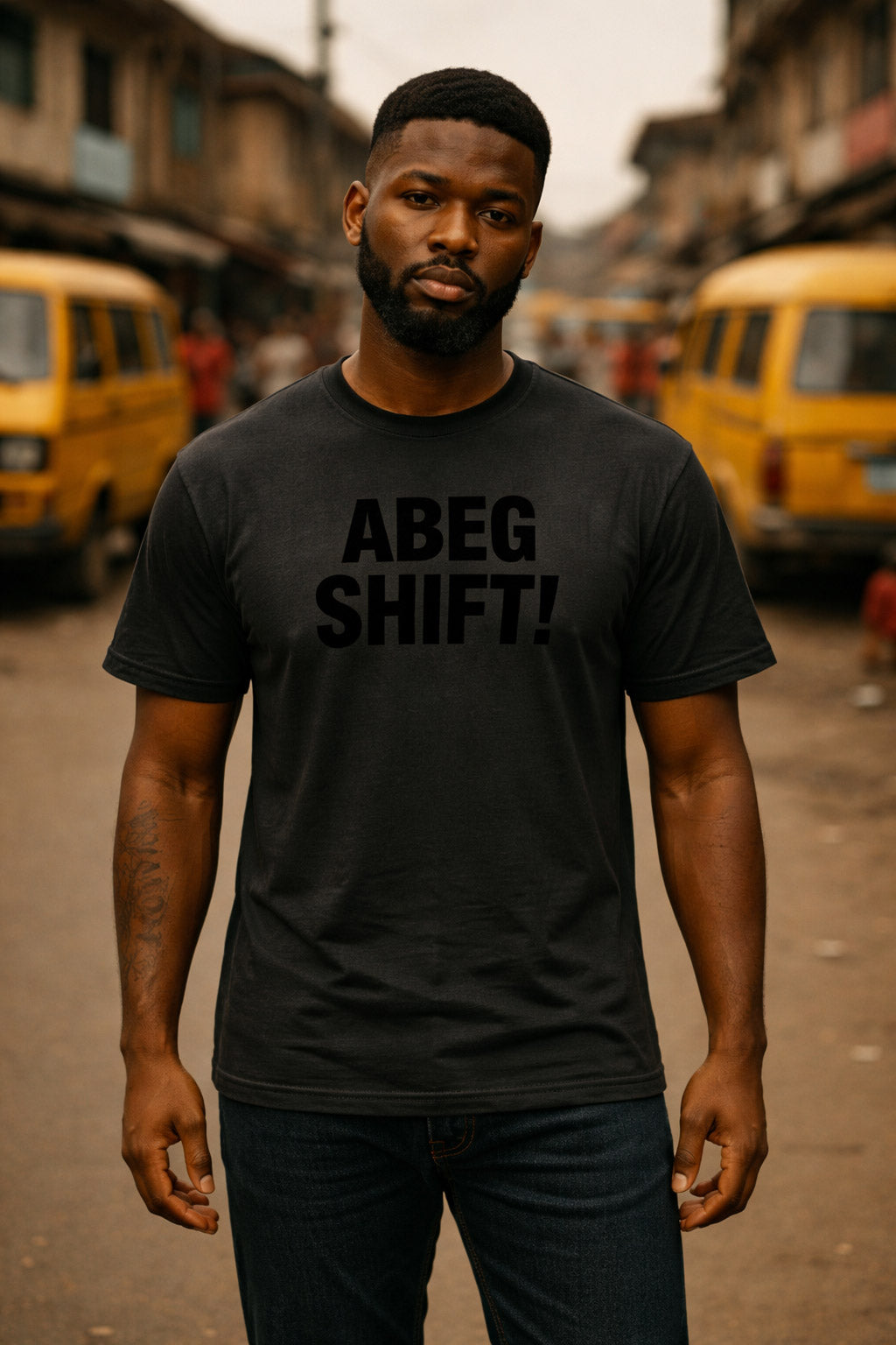 Serious guy stand for street wear abeg shift tee to maintain his lane with peace.