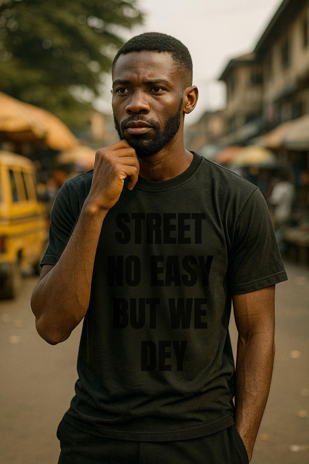 Thoughtful man touching chin wearing street no easy but we dey showing steady survival spirit gift.