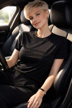 Person wearing my spontaneity is carefully planned while driving, showing preparation allows us to be truly present today.