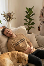 Calm man resting near dog wearing I'm not lazy I'm on power-saving mode finding quiet wisdom, perfect gift.