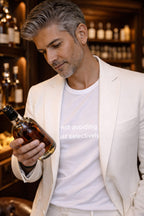 Confident man wearing not avoiding people just selectively social holding a drink honoring his personal peace.