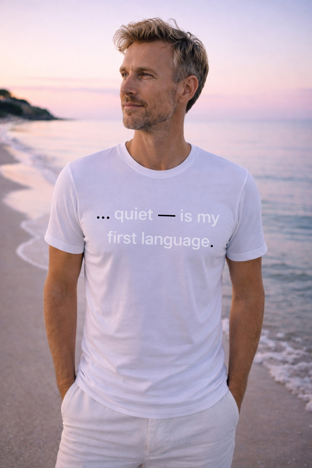 Handsome man wearing quiet is my first language realizing that confidence doesn't need a loud voice to impact.