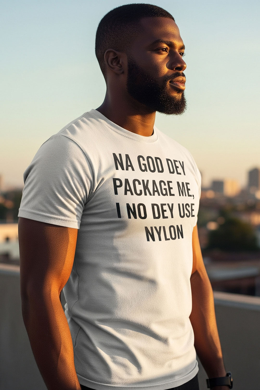 Relaxed man looking sideways wearing na god dey package me I no dey use nylon deep peace gift.