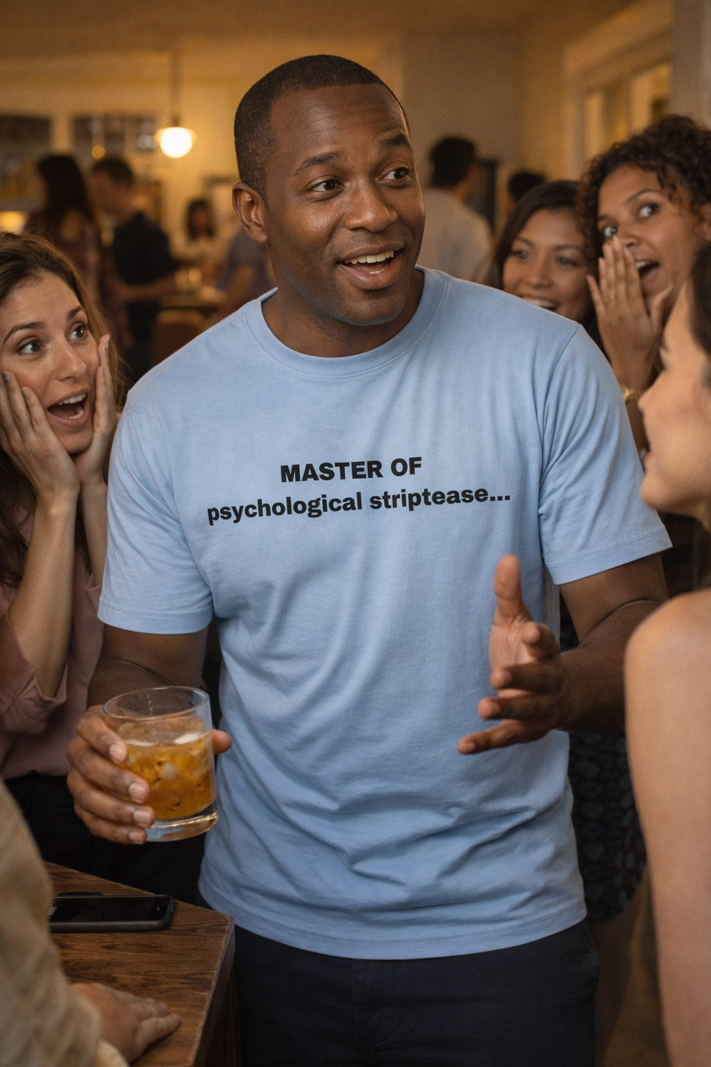 Expressive man telling a story at a party wearing master of psychological striptease tee for friends.