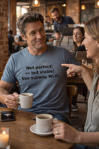 Smiling man chatting in a cafe wearing not perfect but stable like subway Wi-Fi shirt for friends.