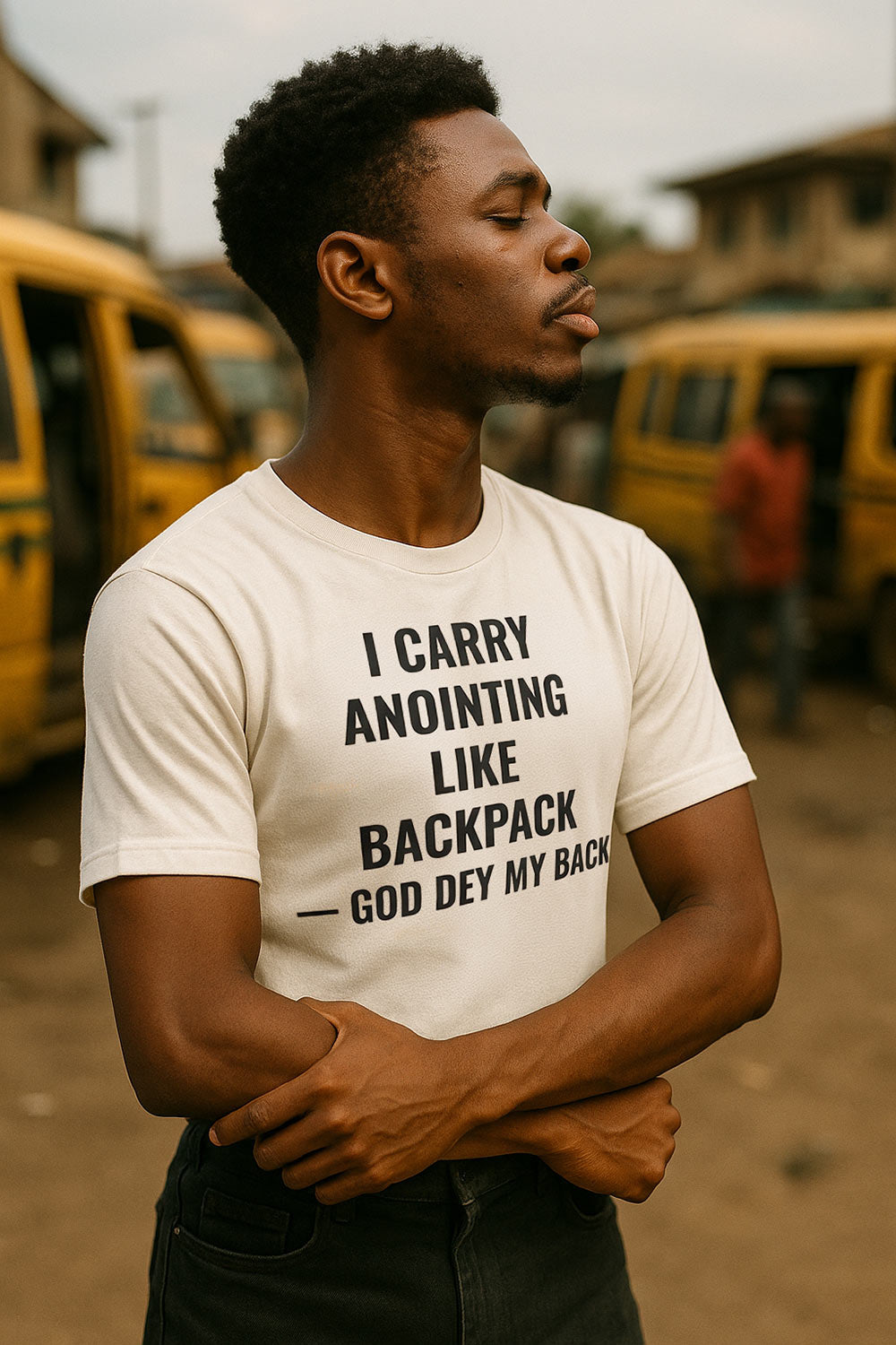 Relaxed man looking sideways wearing I carry anointing like backpack God dey my back divine protection perfect gift.